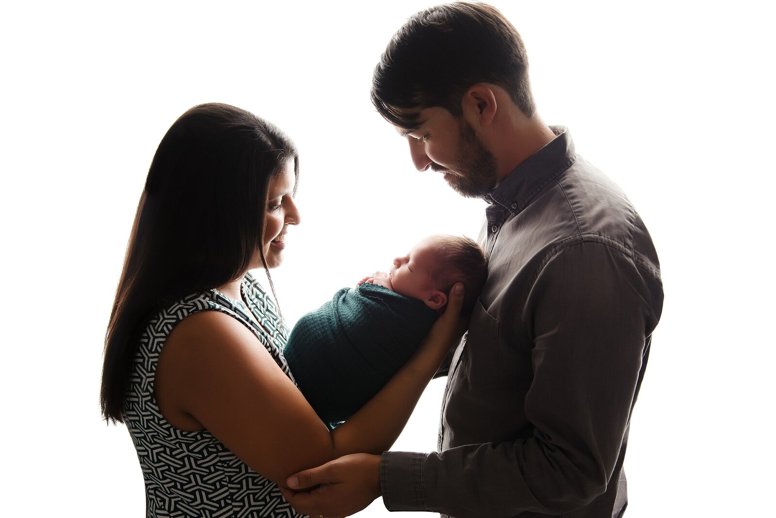 family with newborn on high key backdrop