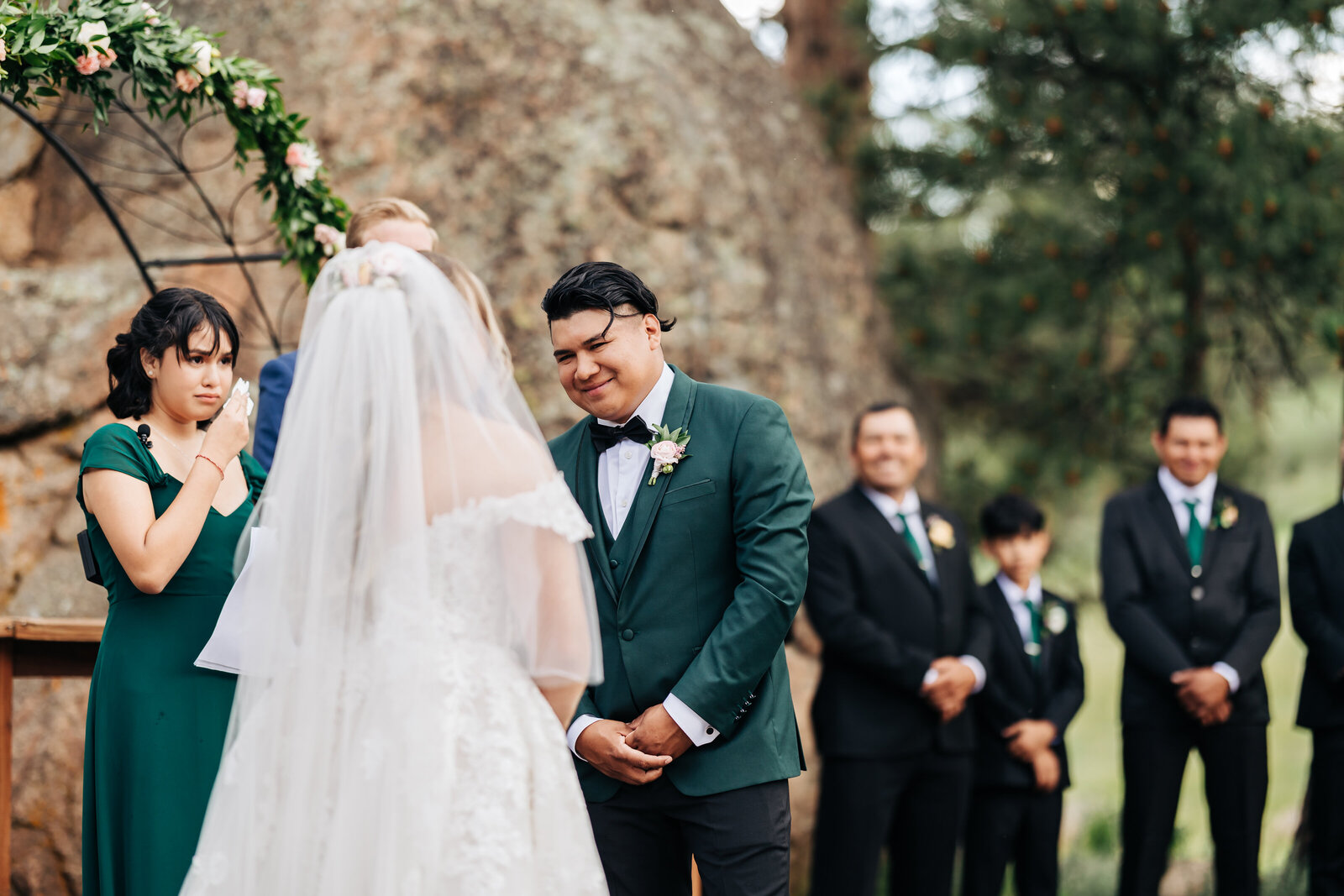 Colorado Elopement Photographer captures groom smiling during vows