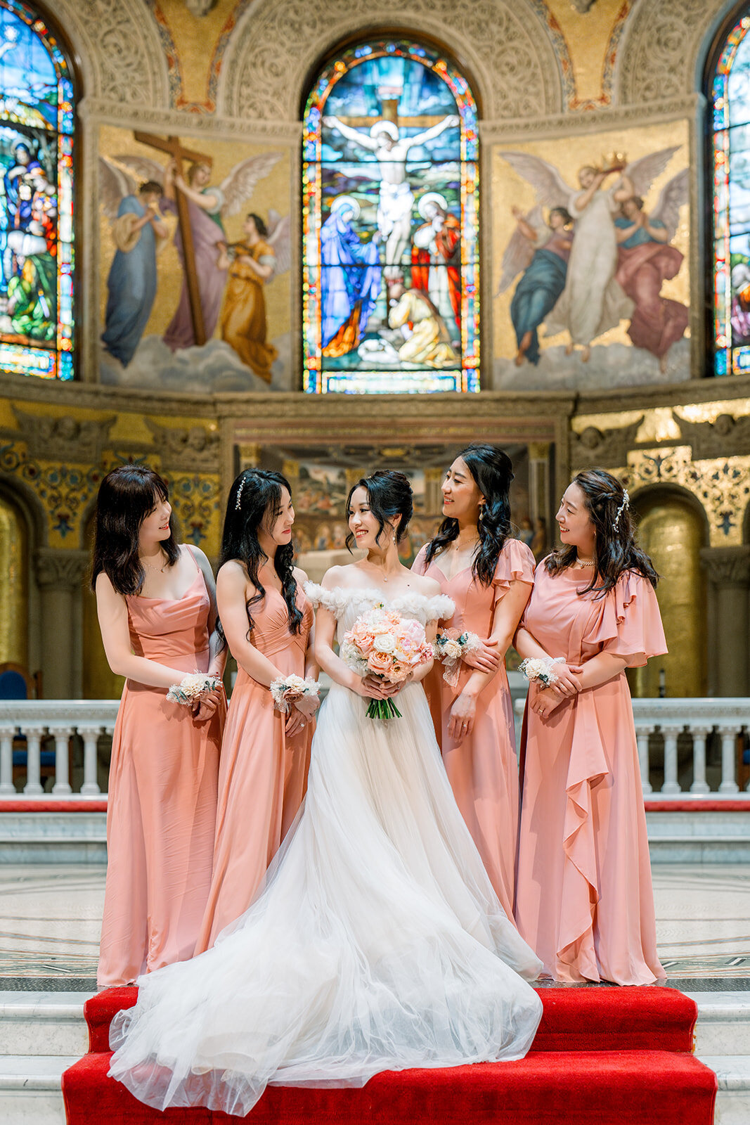 The bridesmaids celebrate the wedding day at the iconic Stanford Memorial Church, California.