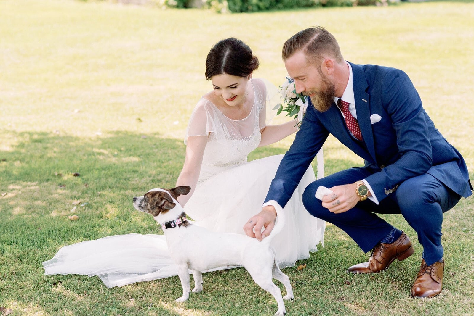 Couple plays with puppy dog on wedding day Pipers Heath Wedding Milton Toronto Wedding Venue Jacqueline James Photography