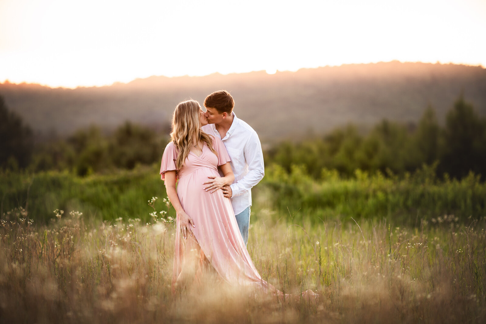 Sunset maternity session in a field located near Birmingham