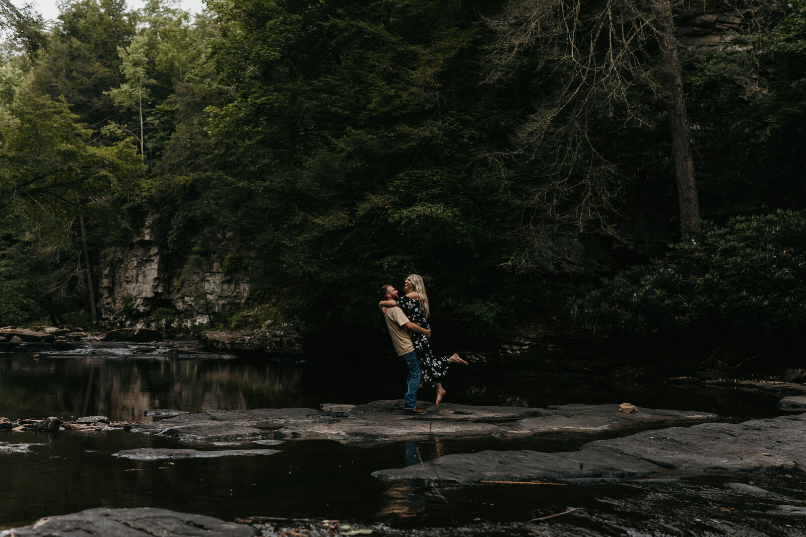 cute couple engagement in woods