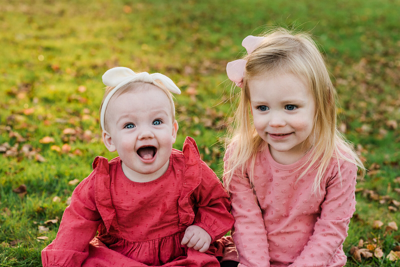 sisters sitting in park
