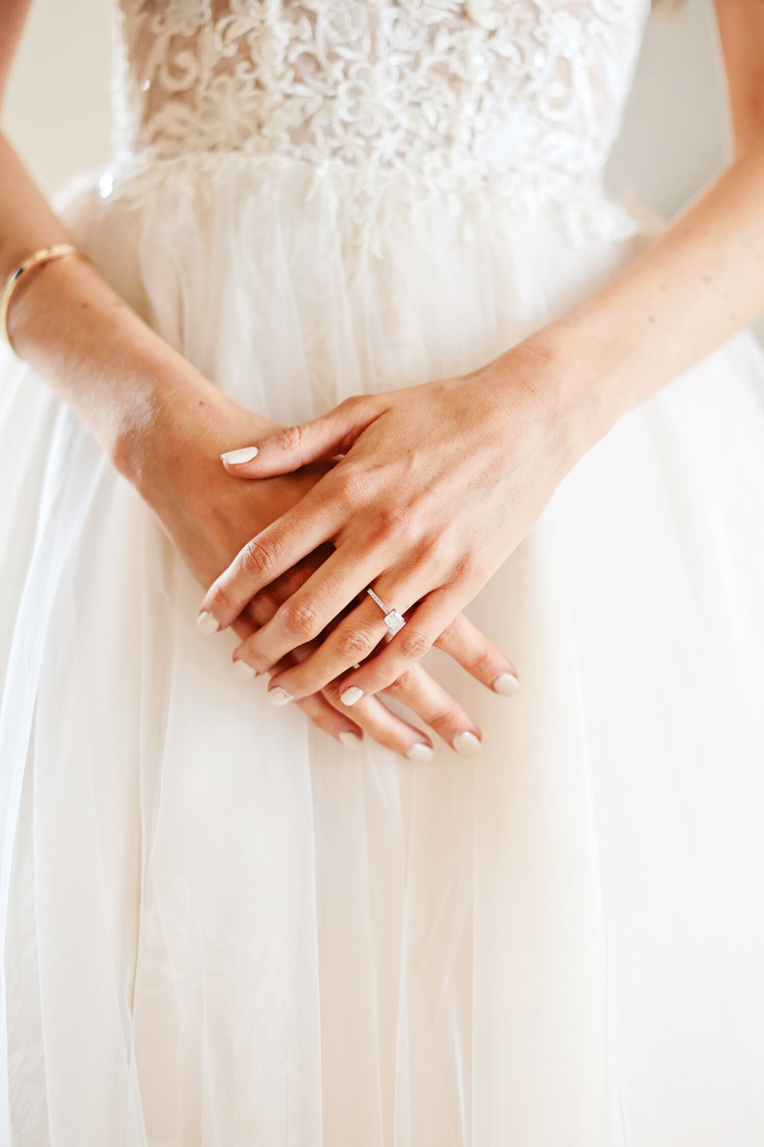 brides-hands-with-engagement-ring