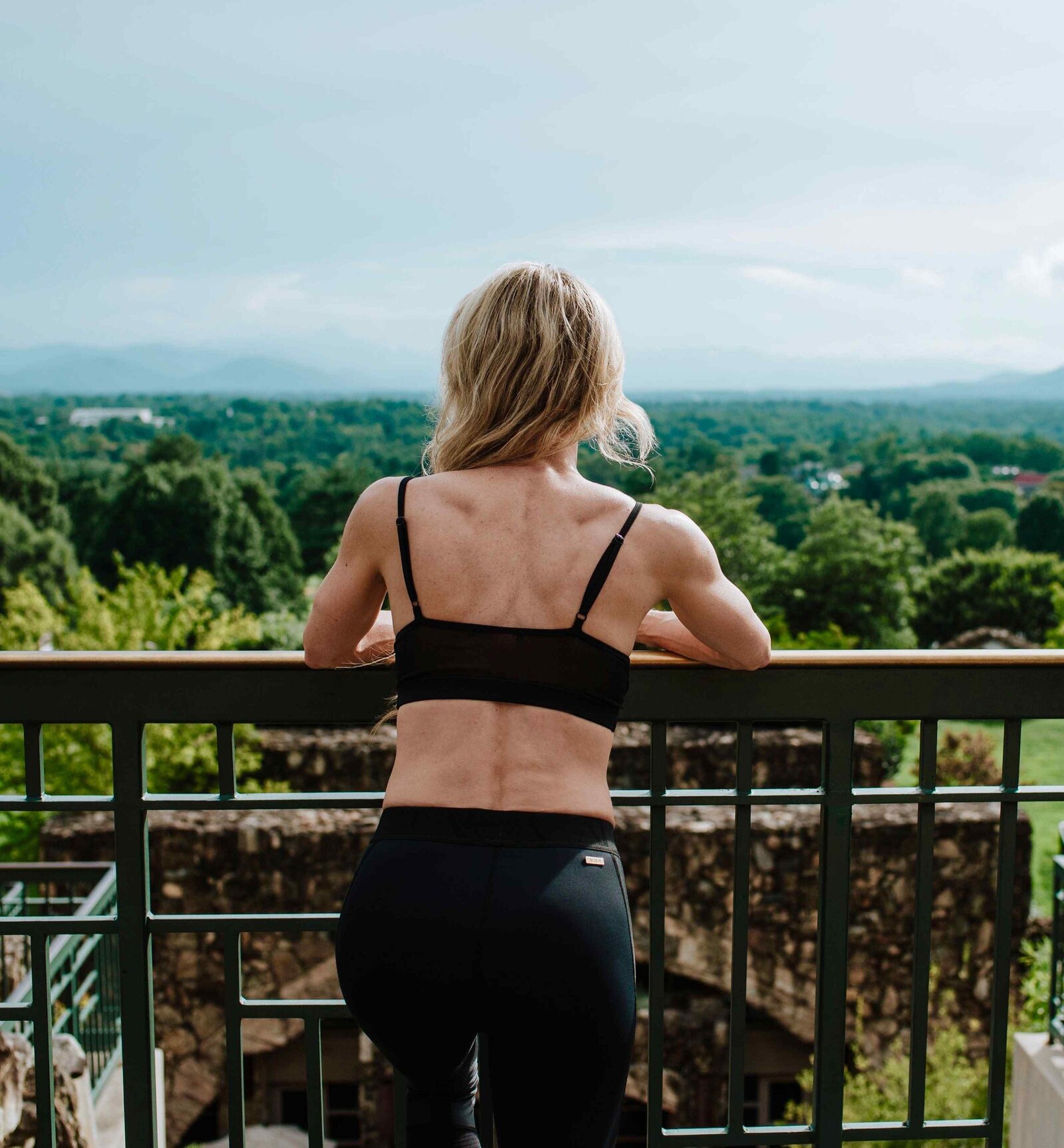 Barb Hawken looking over balcony