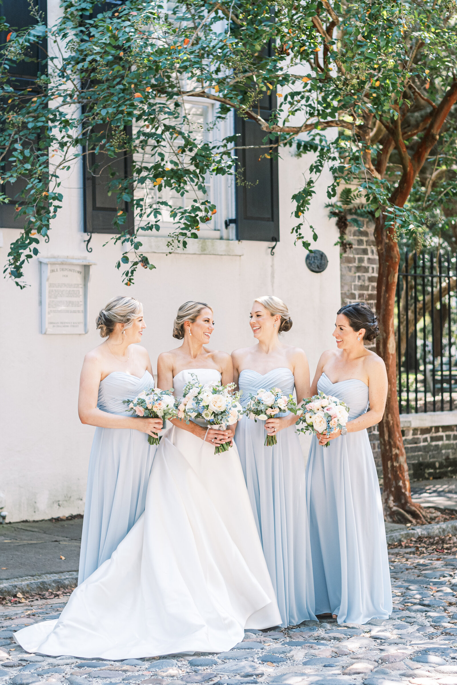 classic blue bridesmaids downtown Charleston summer wedding Cannon Green