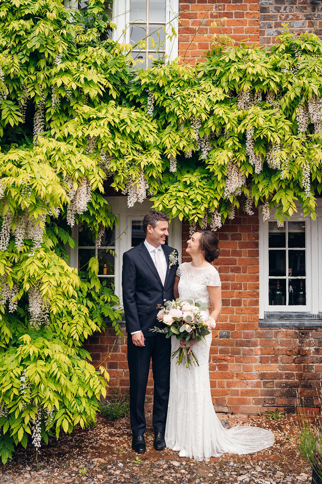 wedding-couple-under-wisteria-spring-wedding