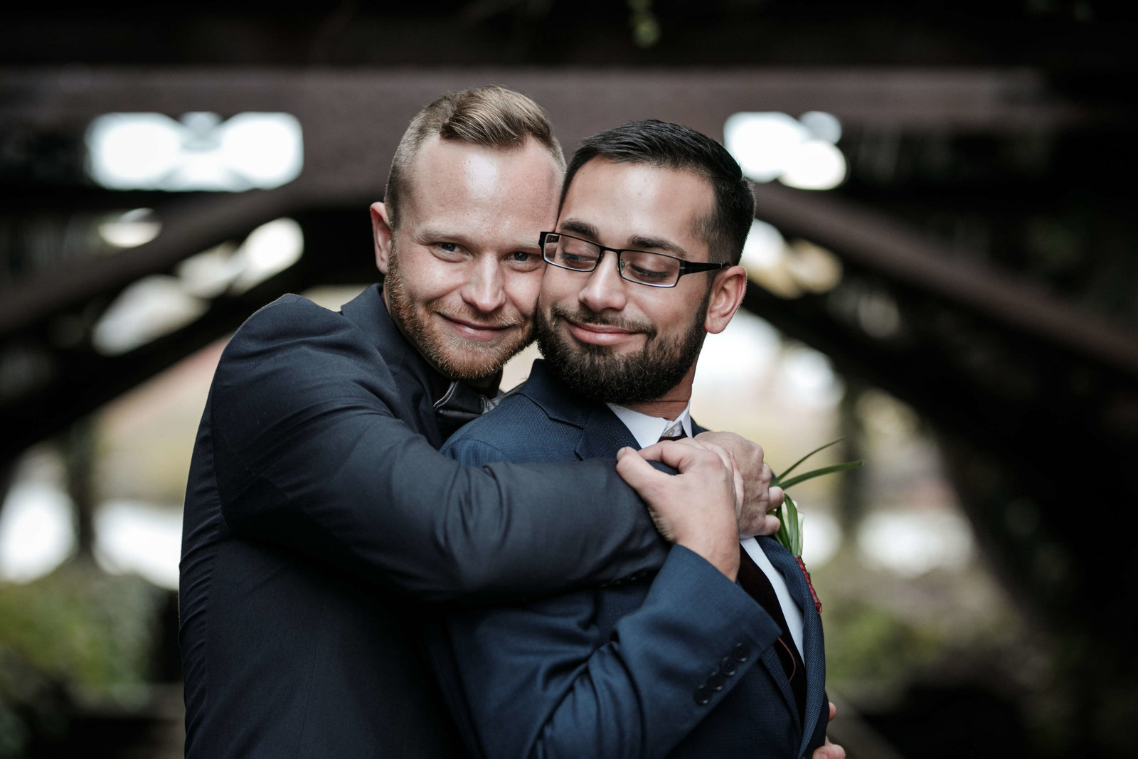 Two grooms embrace at Ohio wedding