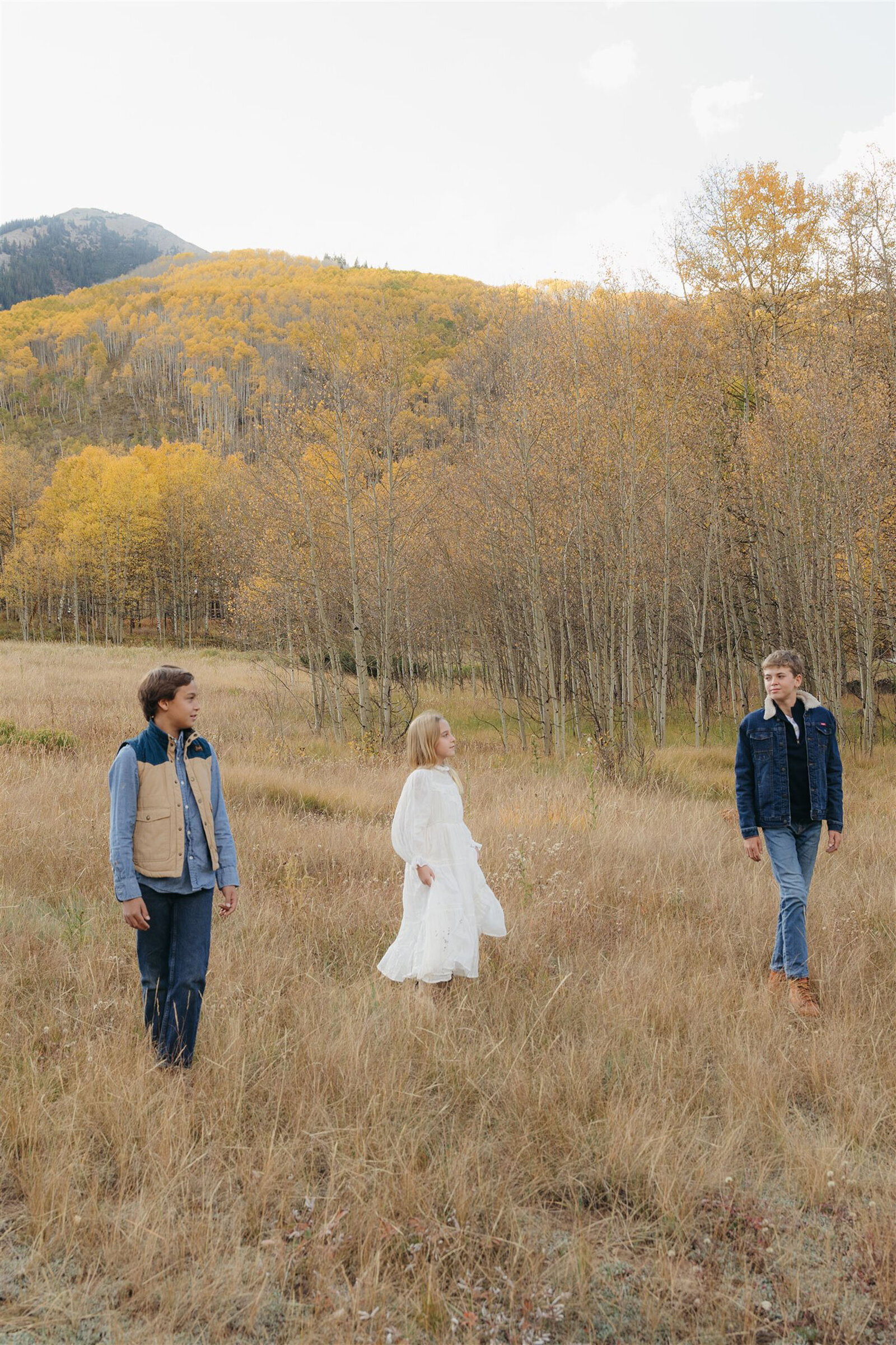 Editorial Aspen family photography — stylish family walking together in classic Ralph Lauren–inspired outfits.