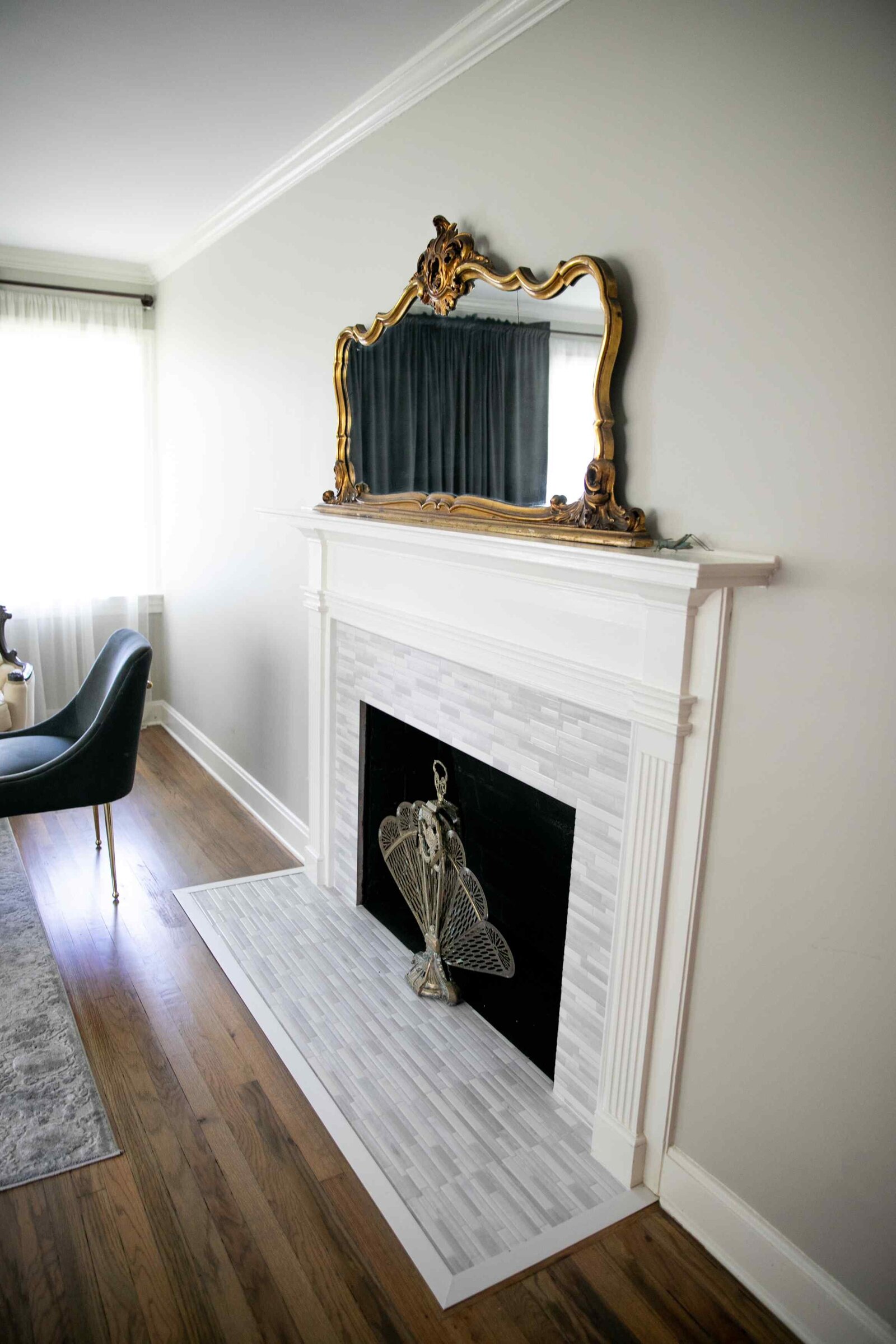 white mantle and antique mirror