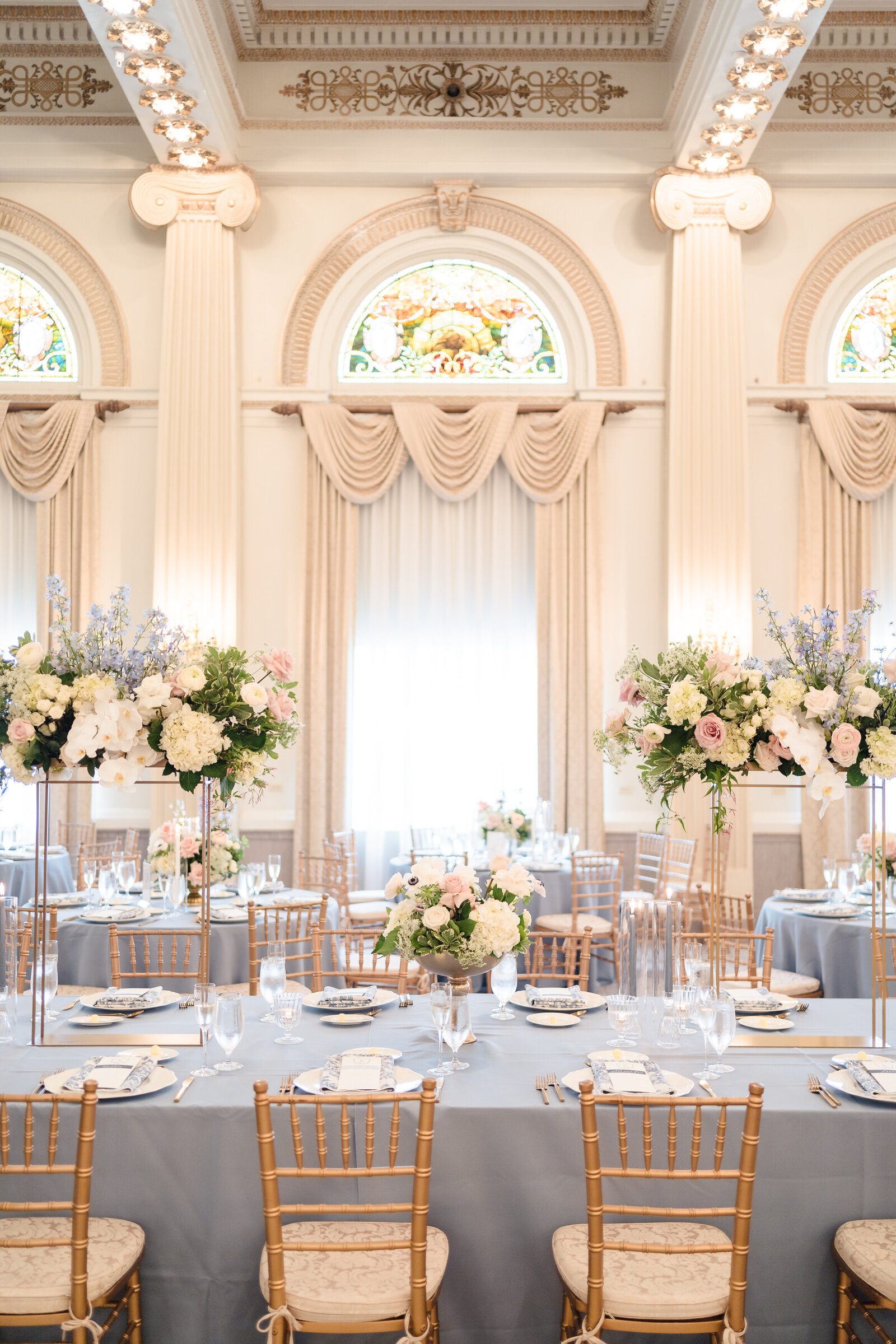 Photo of the head table with large floral centerpieces inside the Westin Great Southern