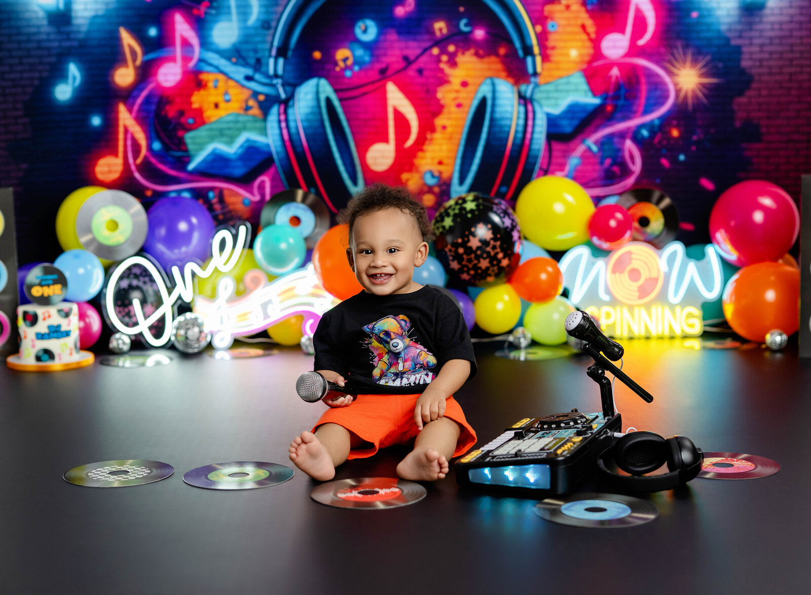 baby listening to music on DJ birthday set. Photographed in Atlanta by Jenni Nikki Photography.