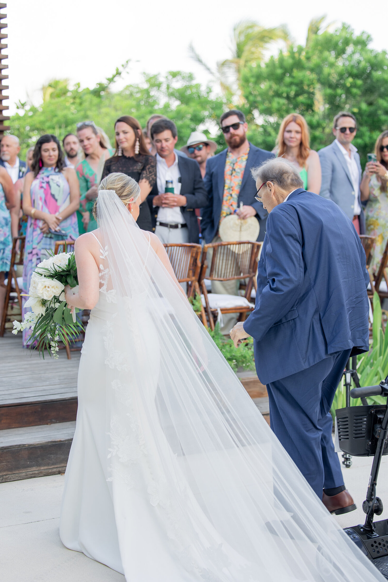 outdoor beach wedding bride walking down aisle