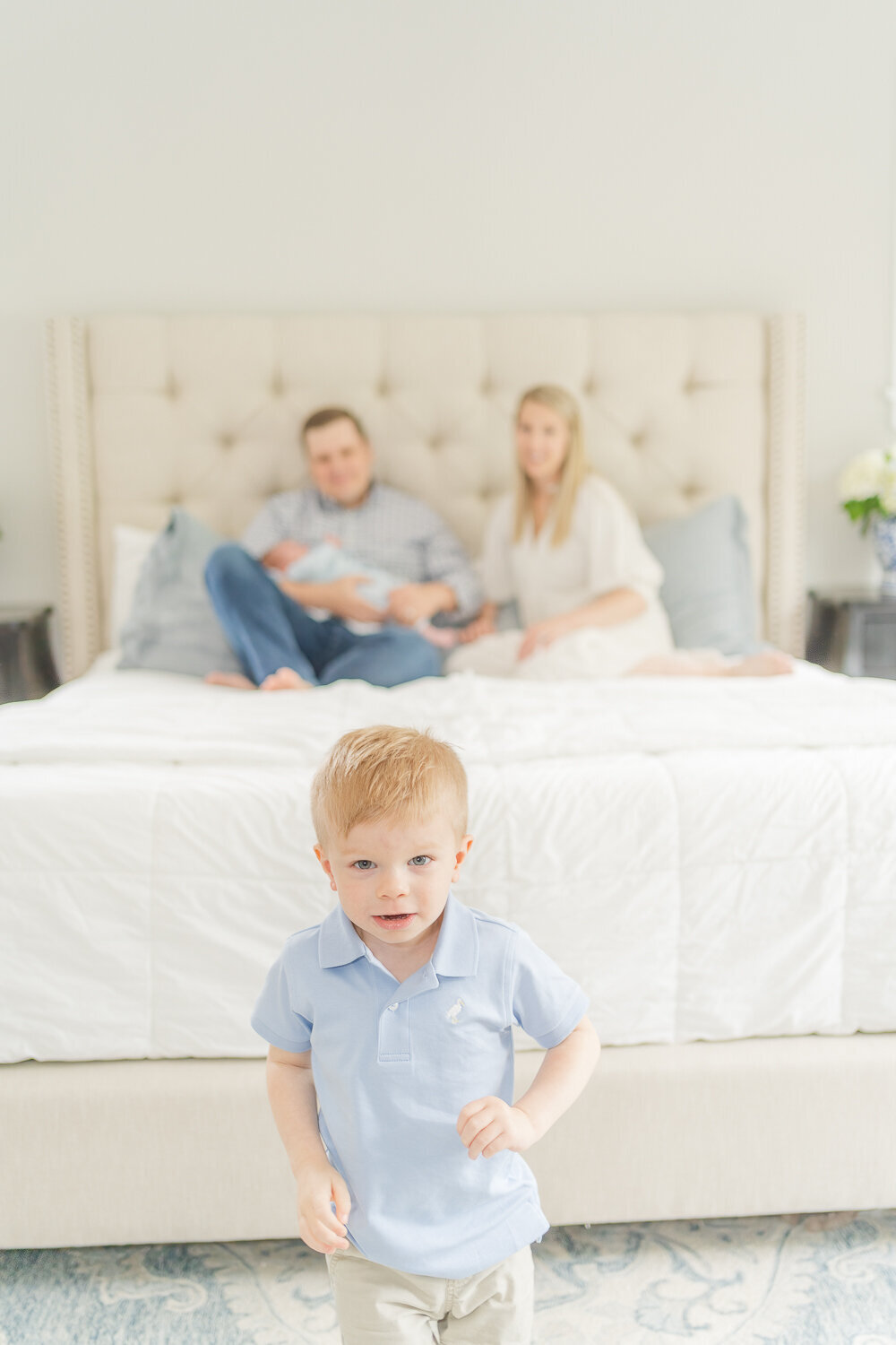 big brother running away during newborn session in Bristow, VA