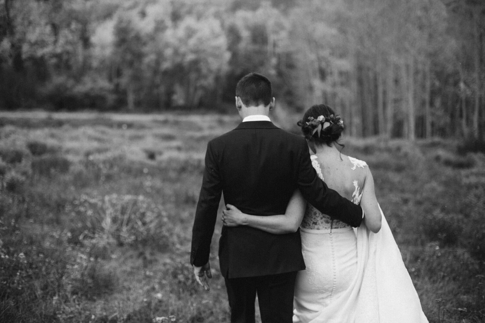 Candid photo of couple cheering with their wedding party in Vail
