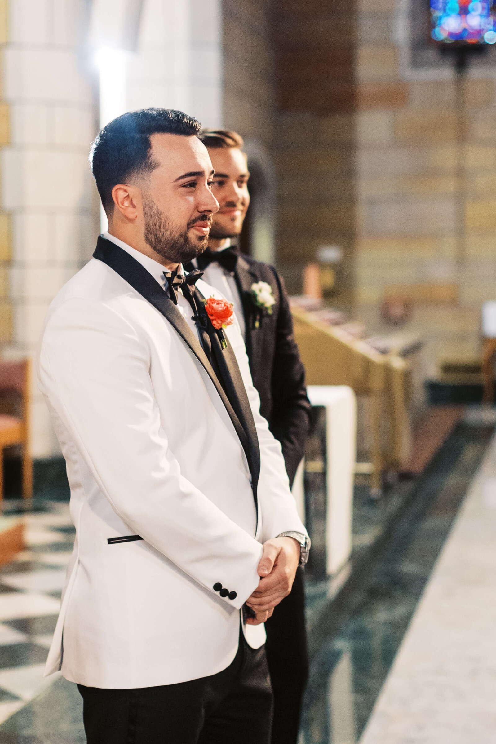 Groom becomes emotional as he watches his soon to be wife walk down the aisle.