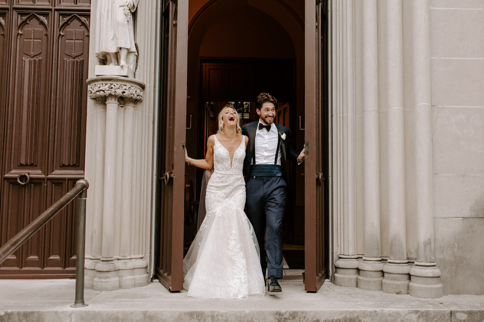 bride and groom grand entrance  with bride laughing