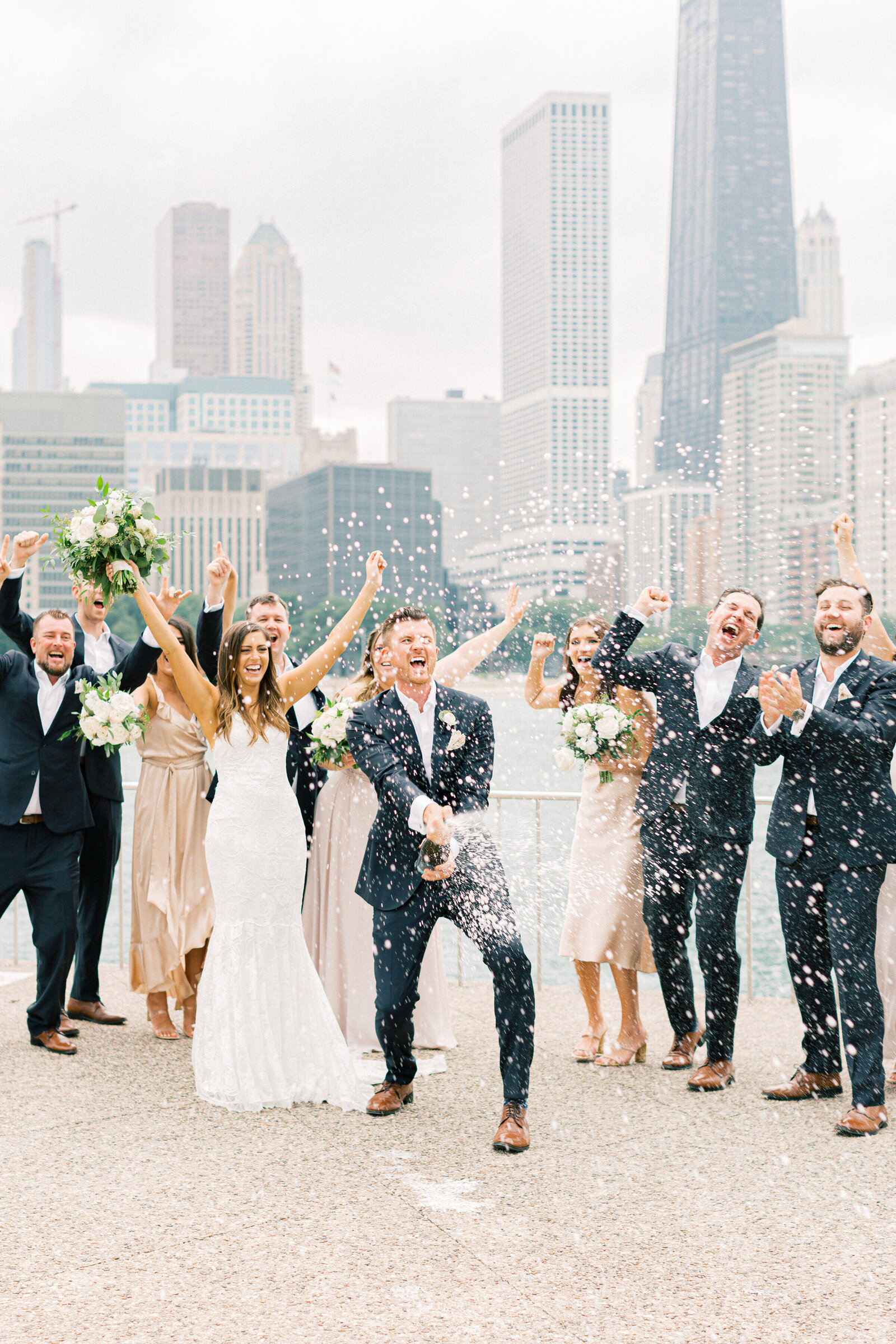 champagne spray wedding portraits at olive park chicago-2