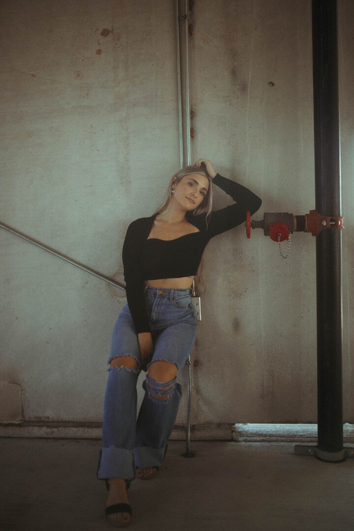 Model posing with industrial style background
