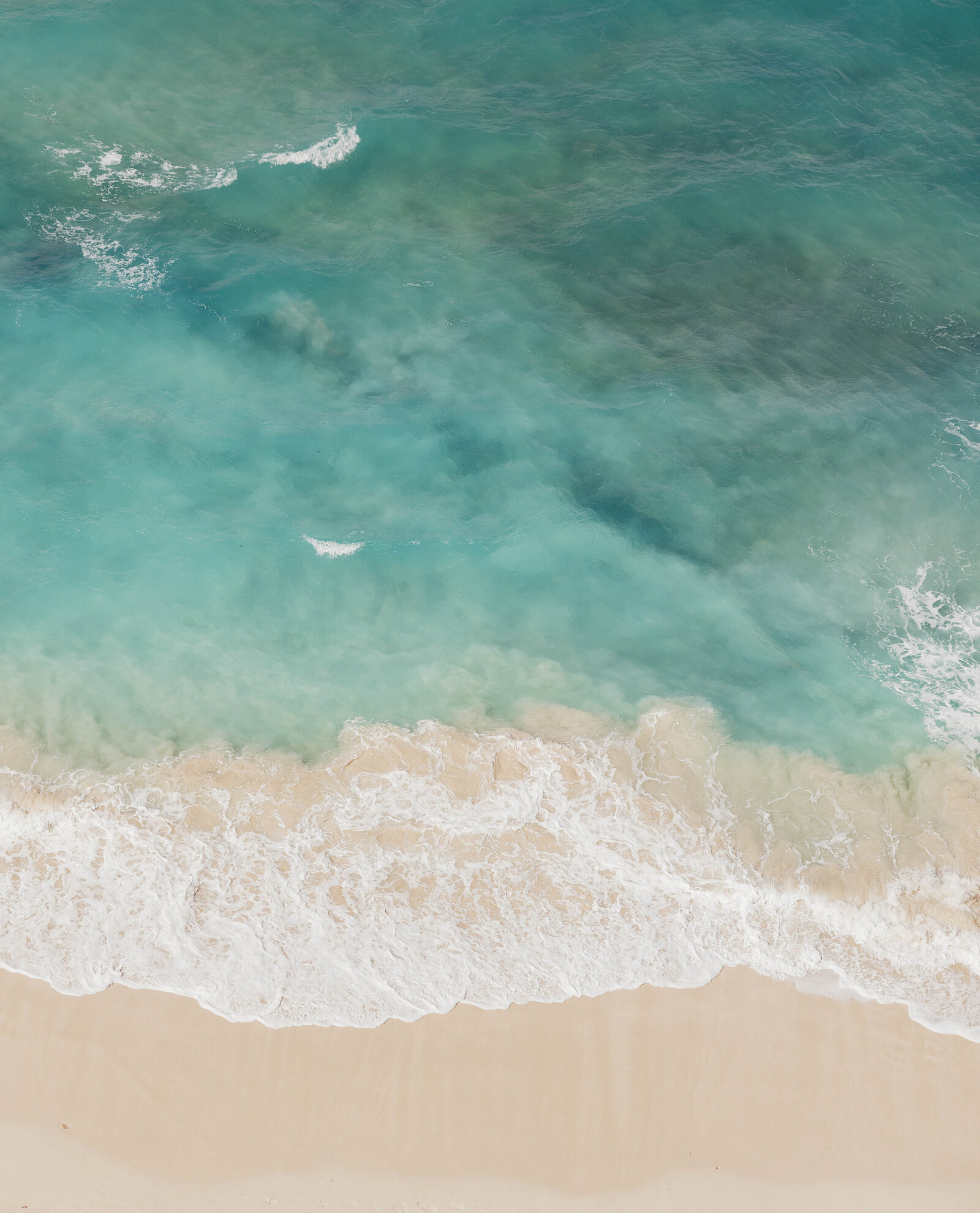 An aerial shot of the ocean capture by an elopement photographer.