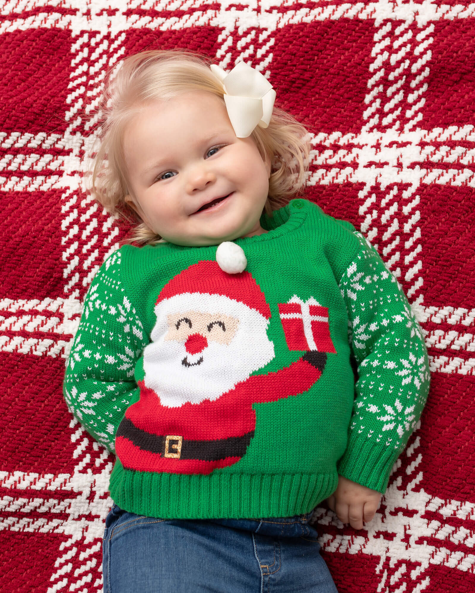 baby girl in ugly christmas sweater