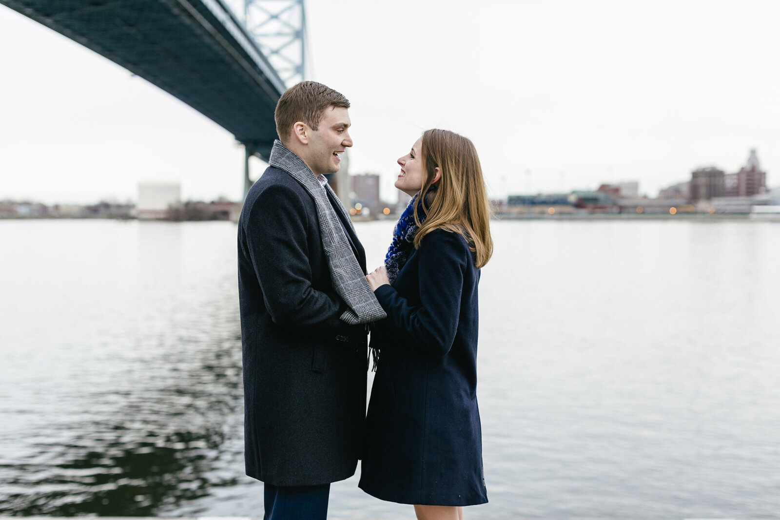 engaged couple ben franklin bridge