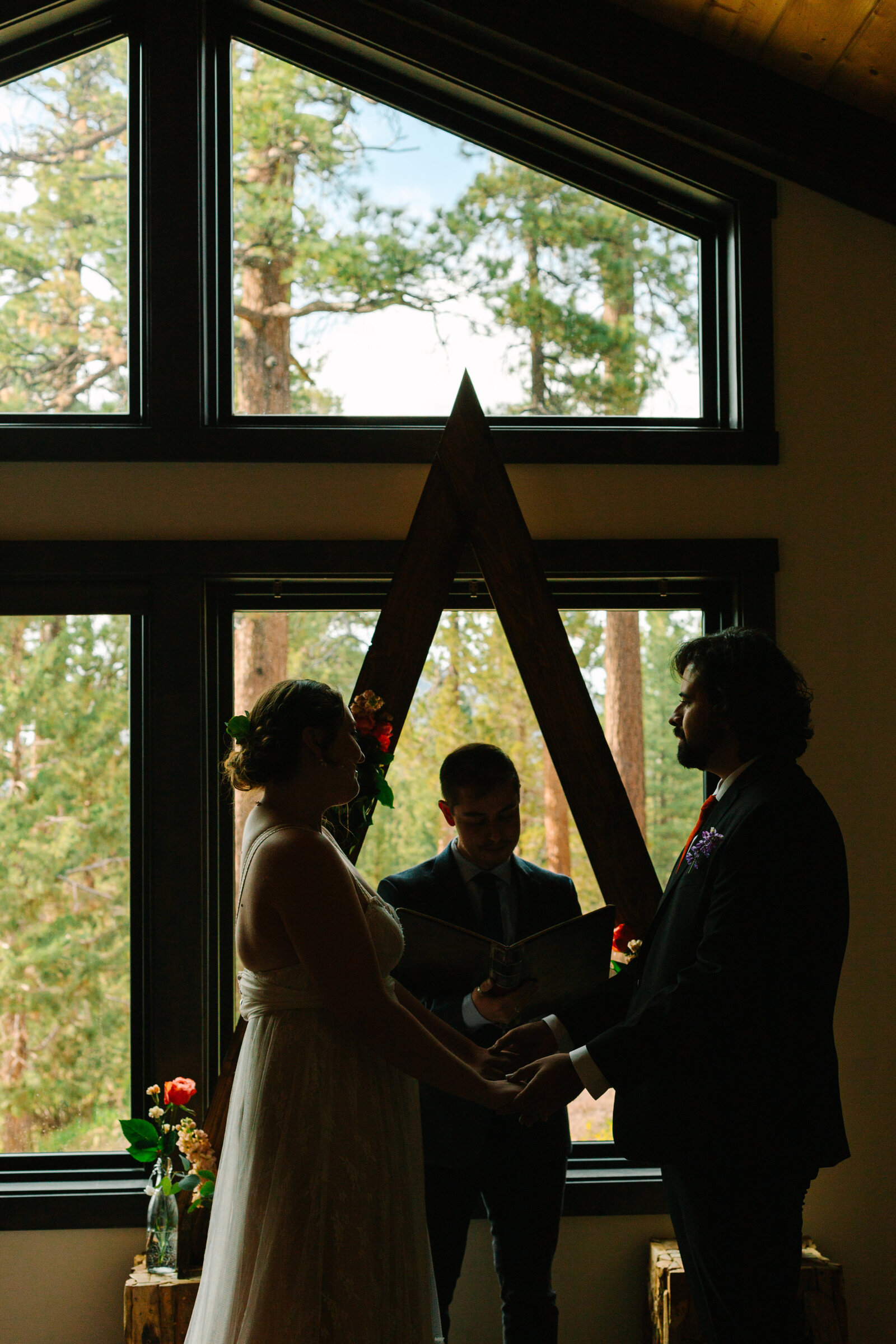 A couple celebrates their intimate elopement at a cabin at Big Bear Lake, California.