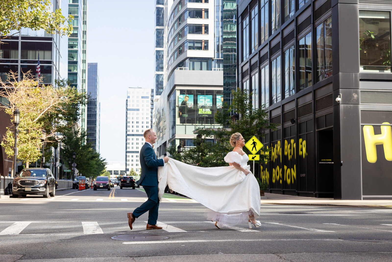bride-and-groom-run-across-city-street-seaport-lisa-gilbert-photography
