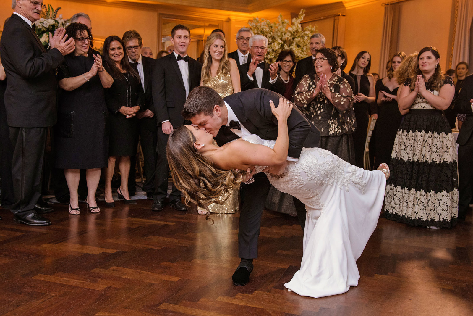 bride and groom kissing during first dance at Glen Head Country Club