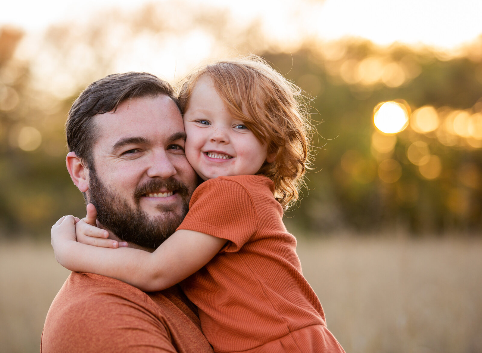 young girl hugging dad