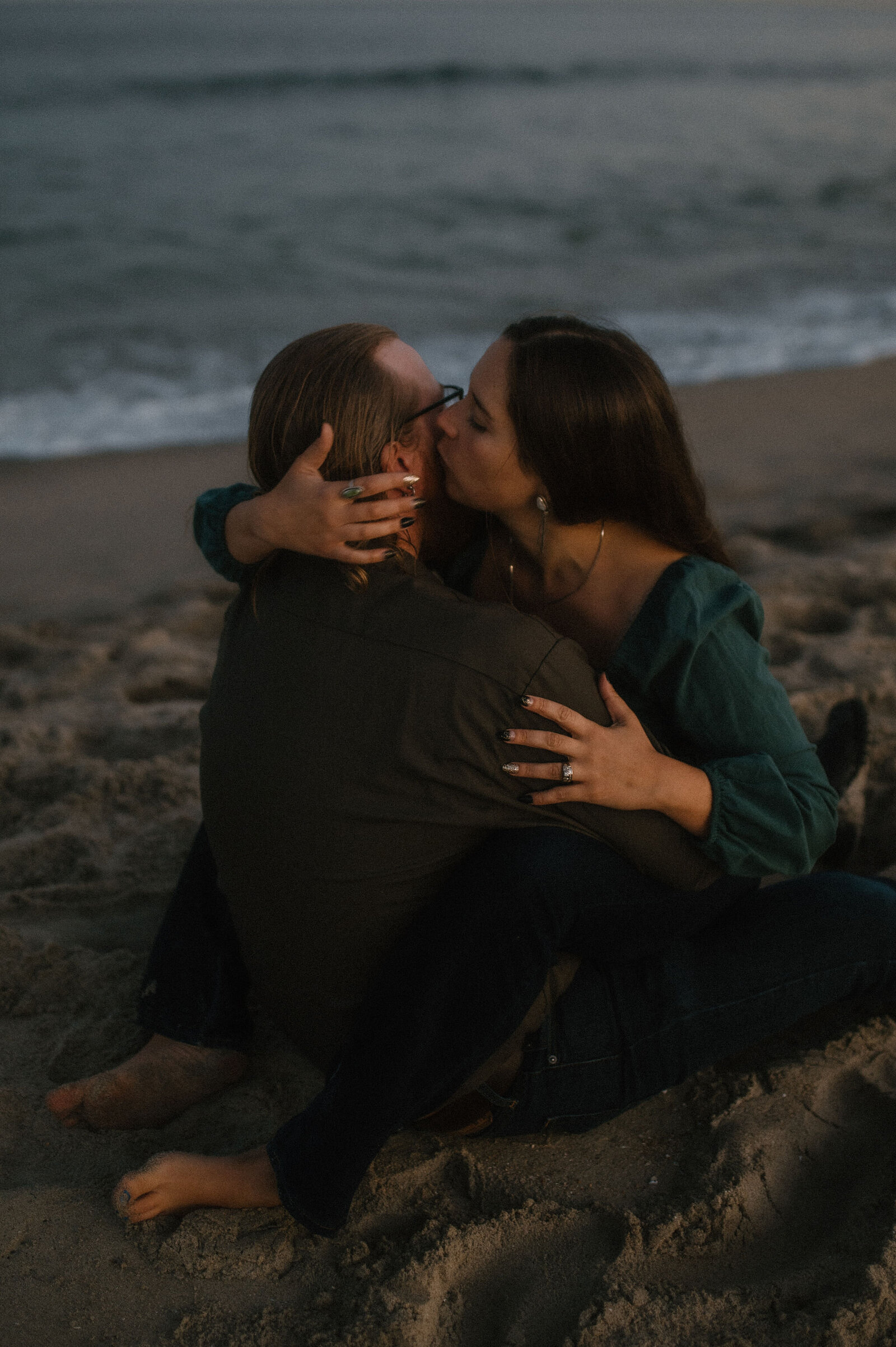 blue hour couple kissing in the sand