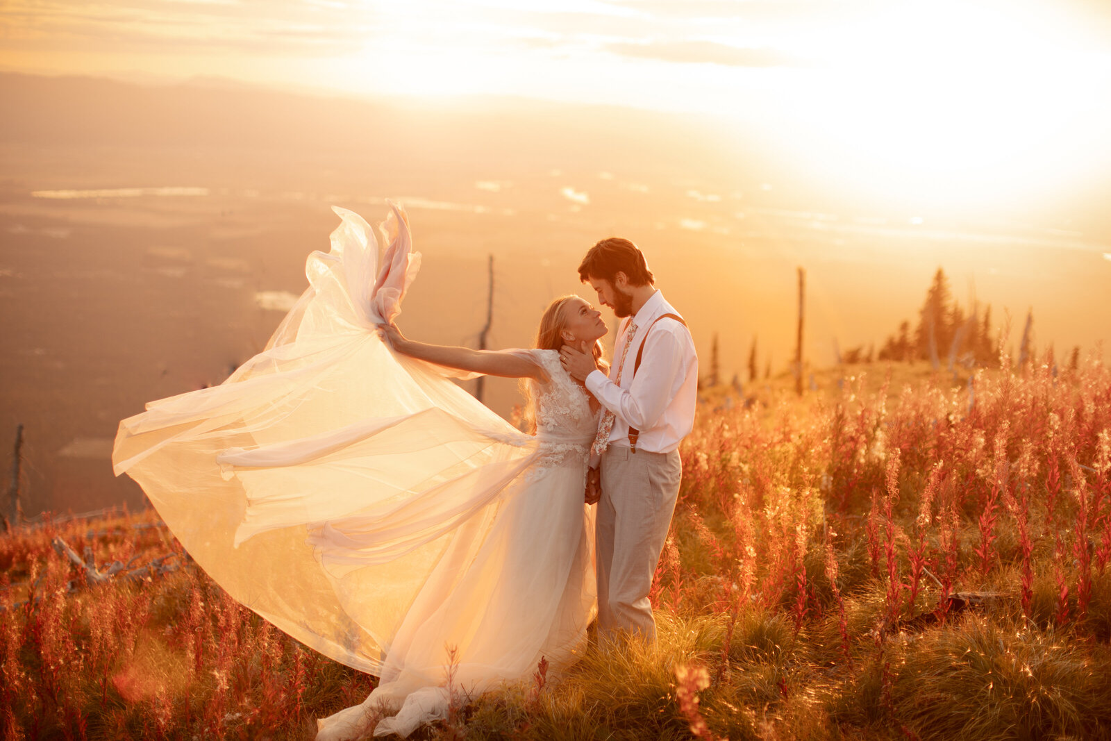 whimsical couple on mountainside in glacial national park