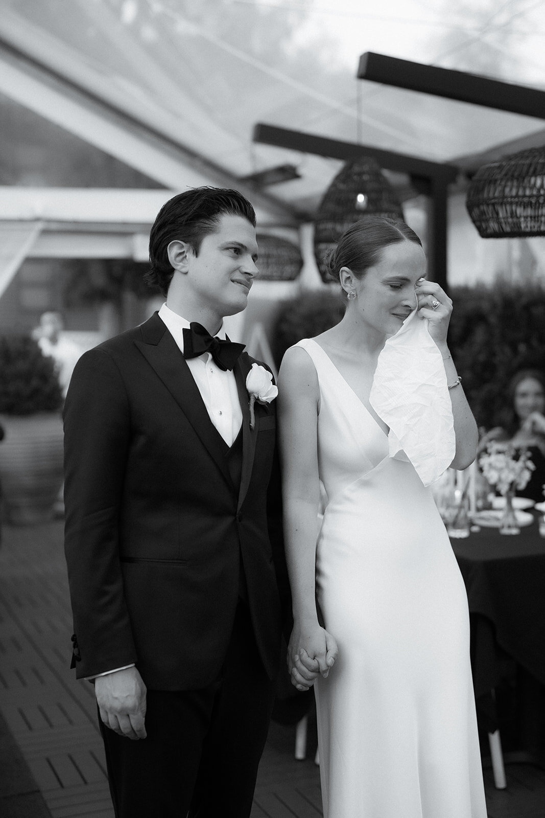 Candid photo of bride and groom at their reception