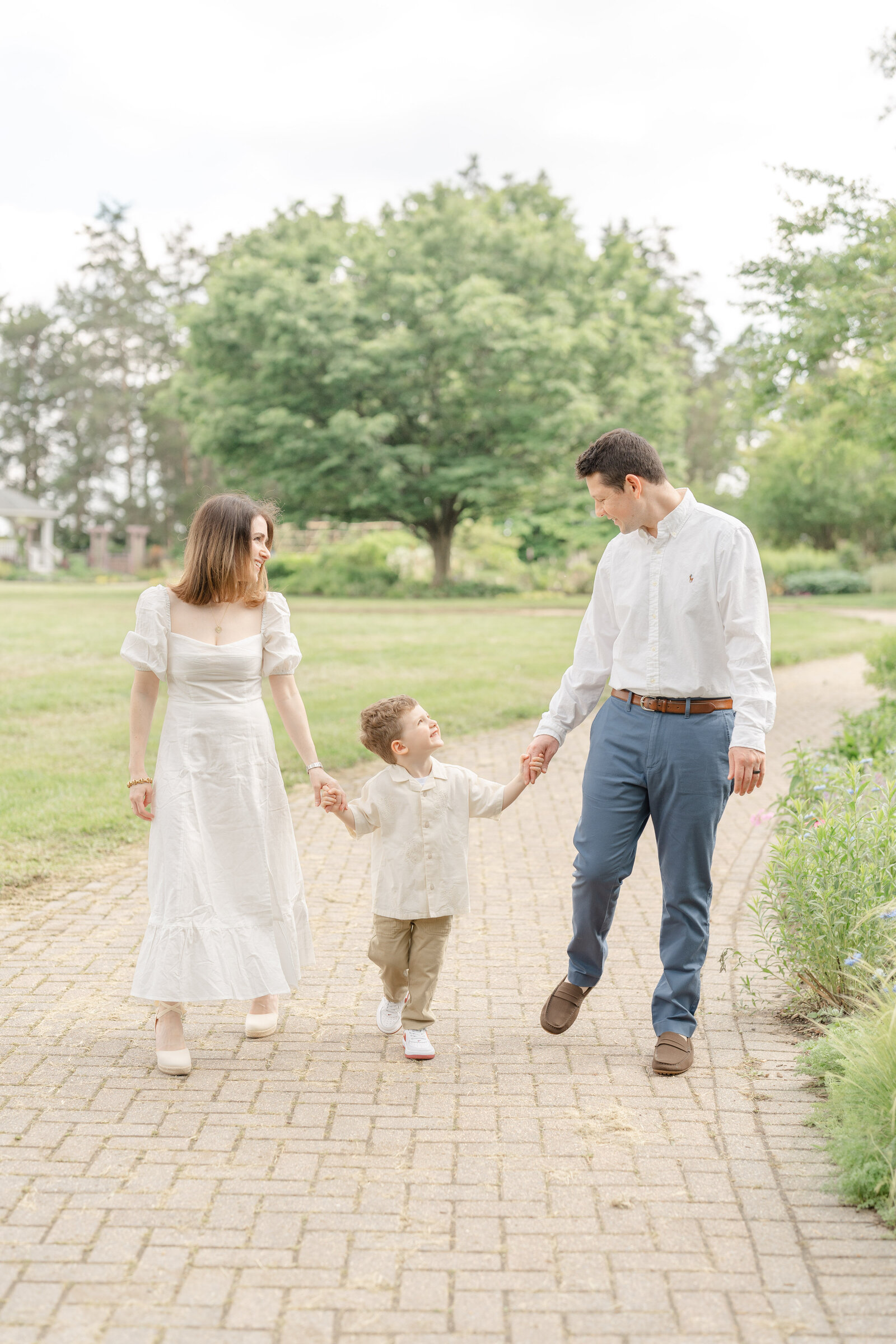 family walking while smiling during Chantilly, Virginia photo