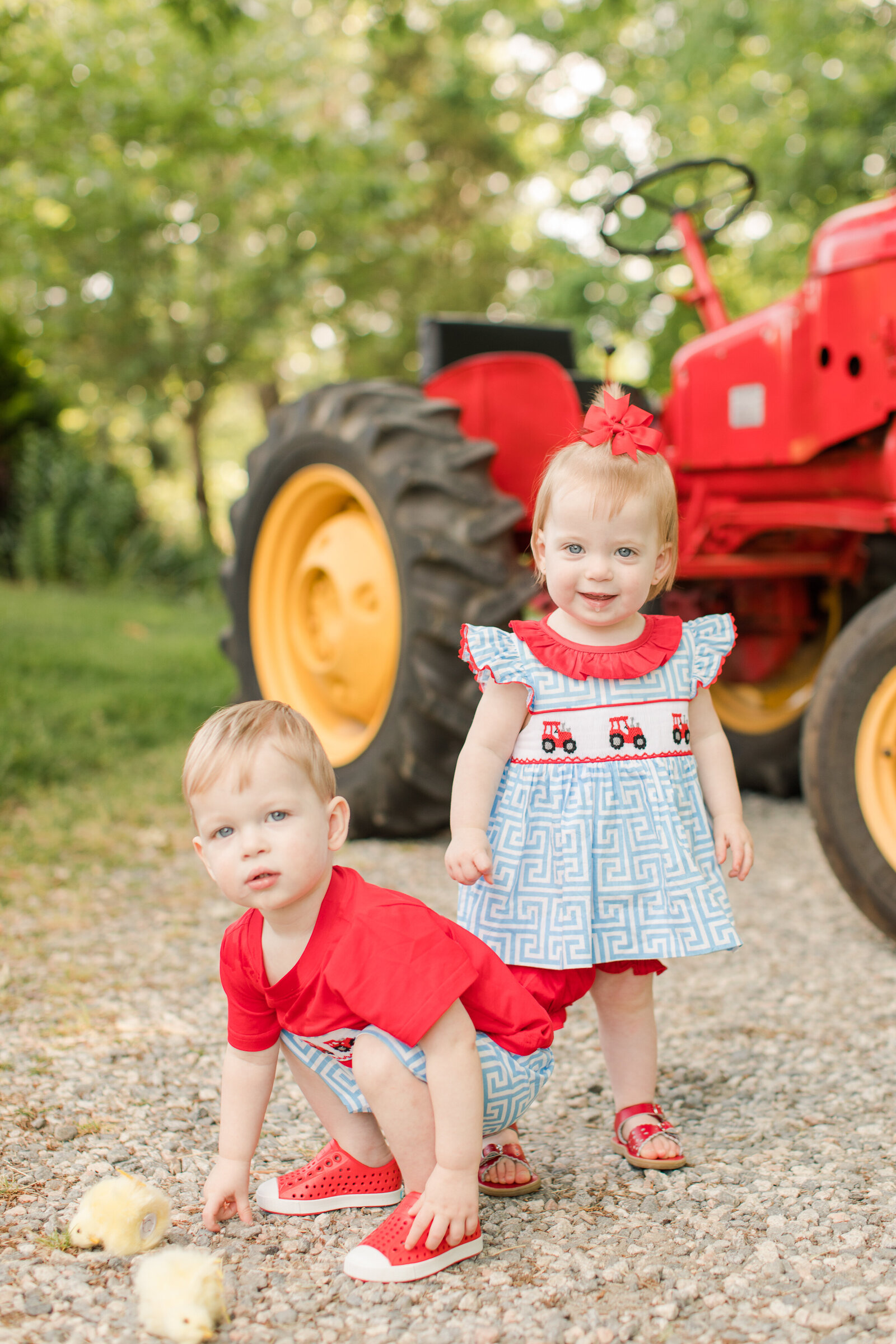 twins infront of a tractor at Dewberry Farms NC