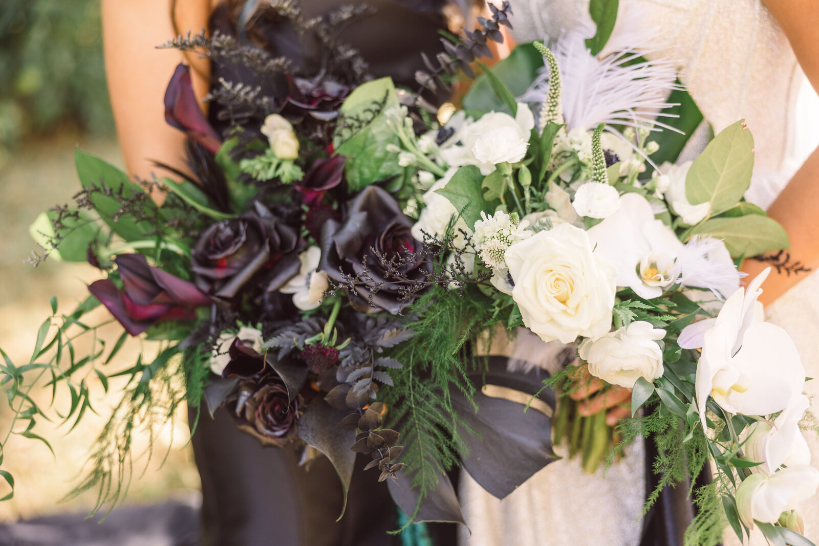 black bridal bouquet and white bridal bouquet