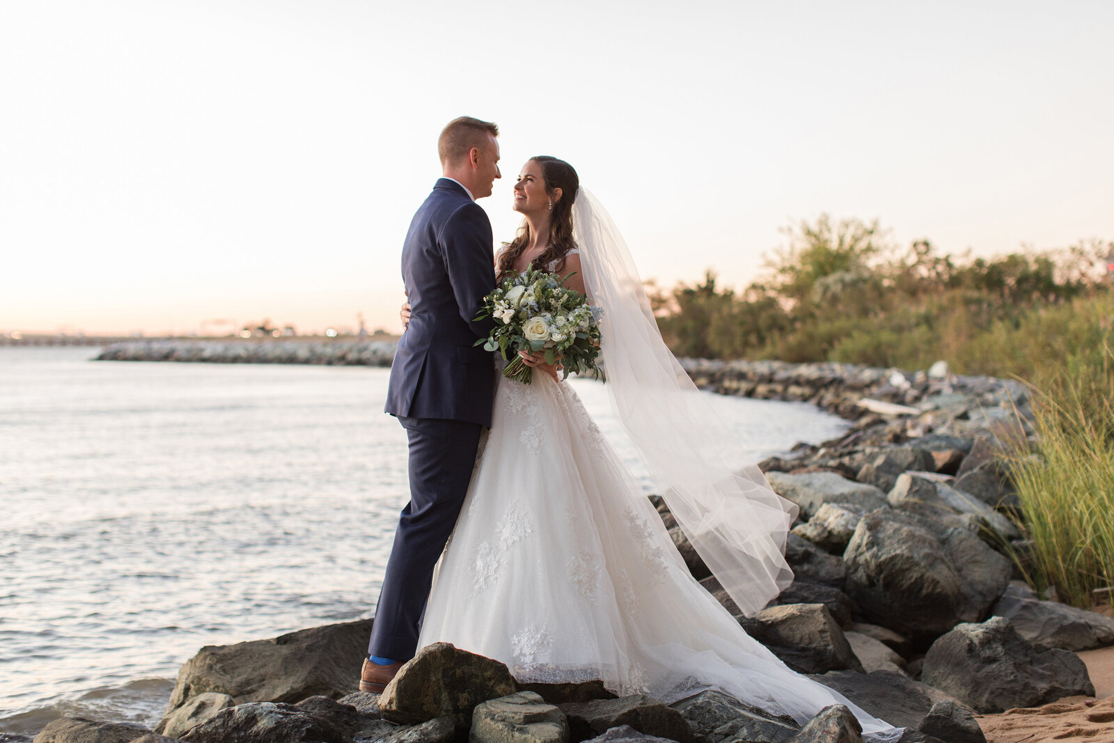 Chesapeake Bay Beach Club wedding photo of couple on beach sunset Ballroom by Annapolis Maryland photographer Christa Rae Photography