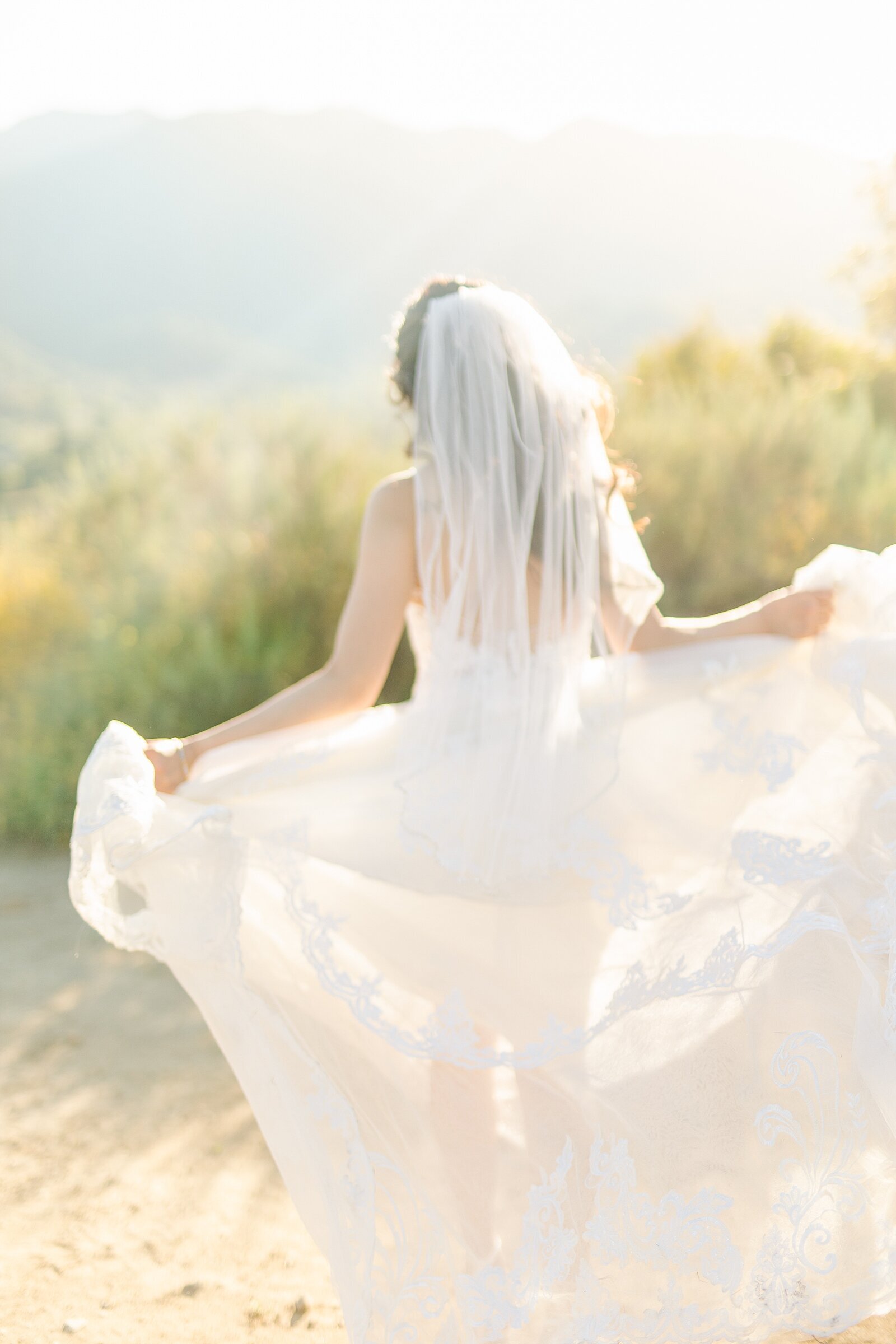 Bride running in her dress at Rancho Bernardo Inn in Rancho Sante Fe.