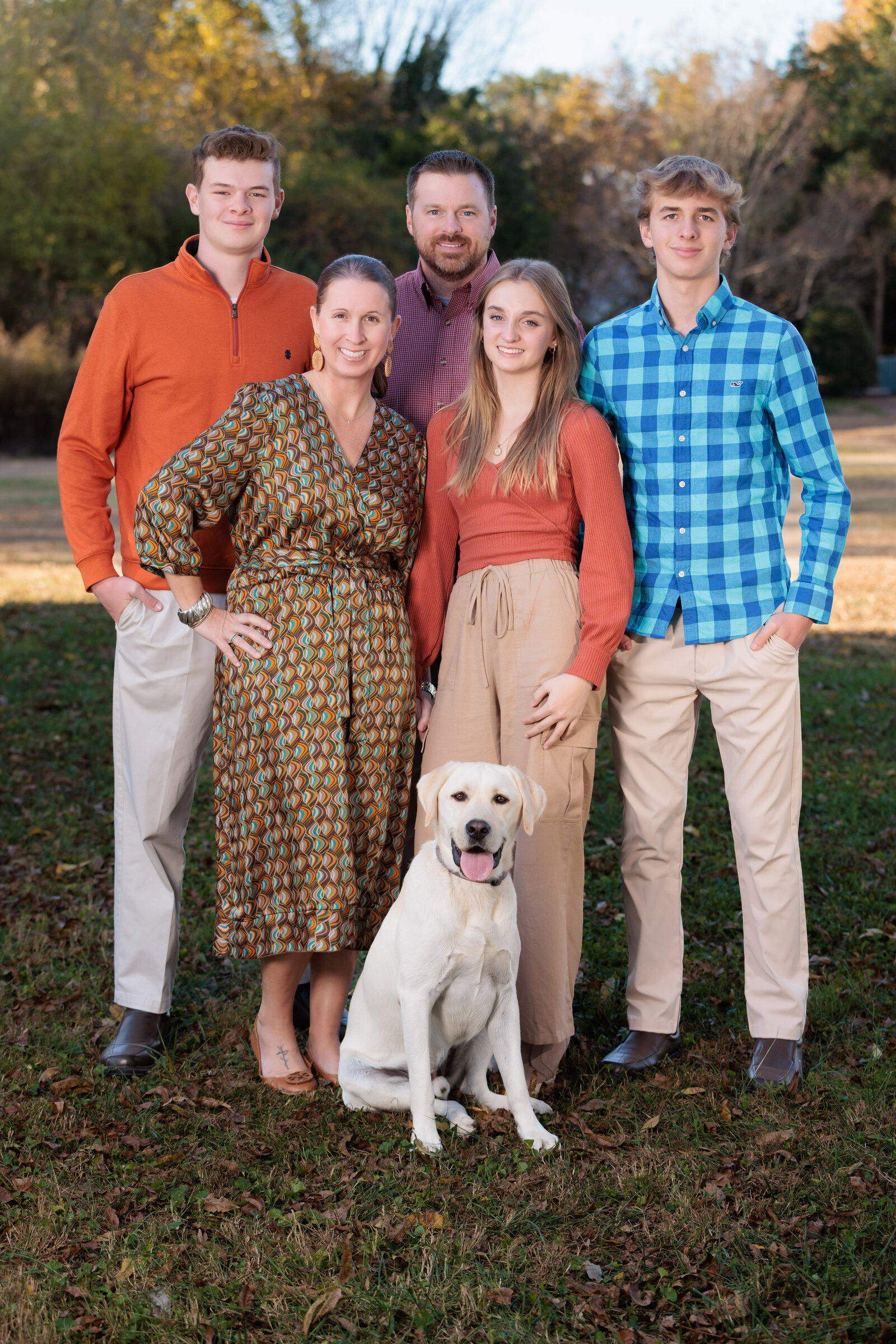 Family portraits including their fur baby in the fall in Raleigh NC.
