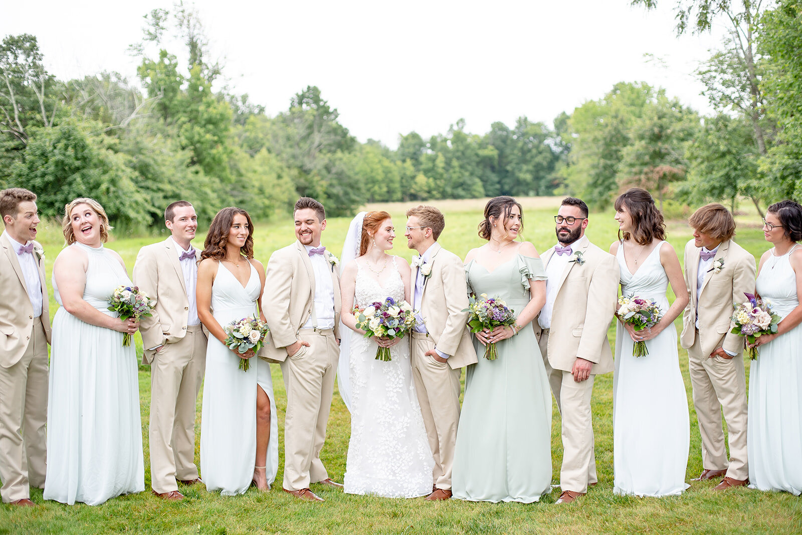 wedding party looking at each other