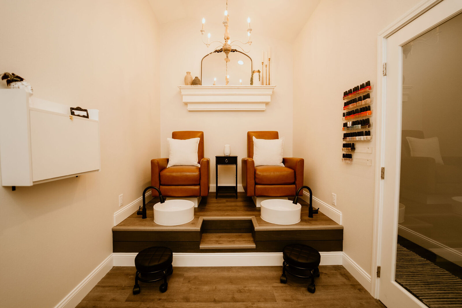 Minimalist, serene spa room at Maven + Grace, featuring curated skincare products and warm lighting.