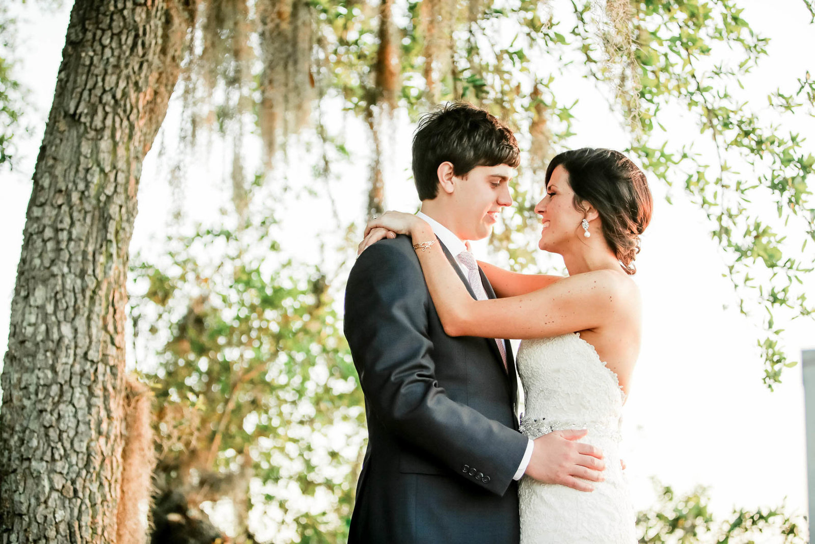 Bride and groom stand by the marsh, I'on Creek Club, Mt Pleasant, South Carolina