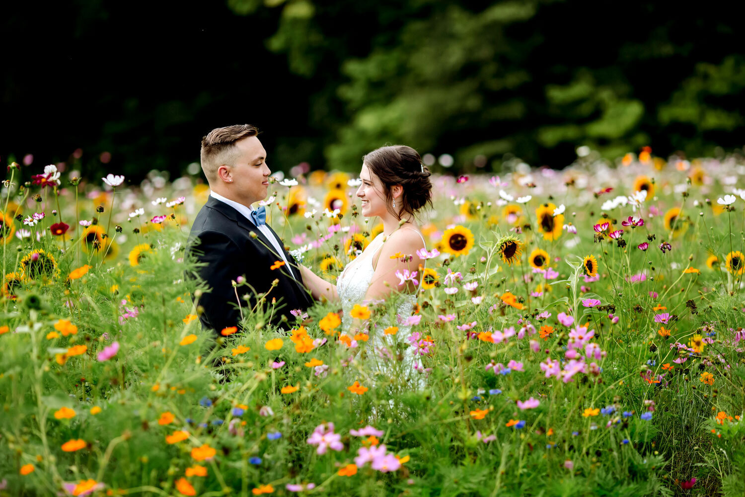 Bride and groom sharing a moment in a vibrant wildflower field