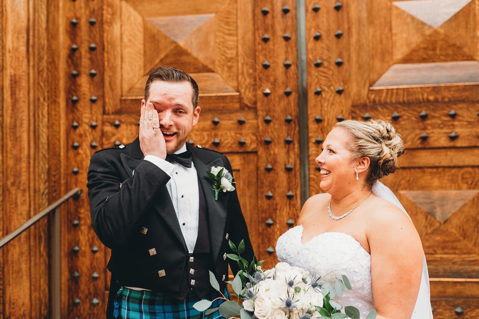 groom wiping away tears