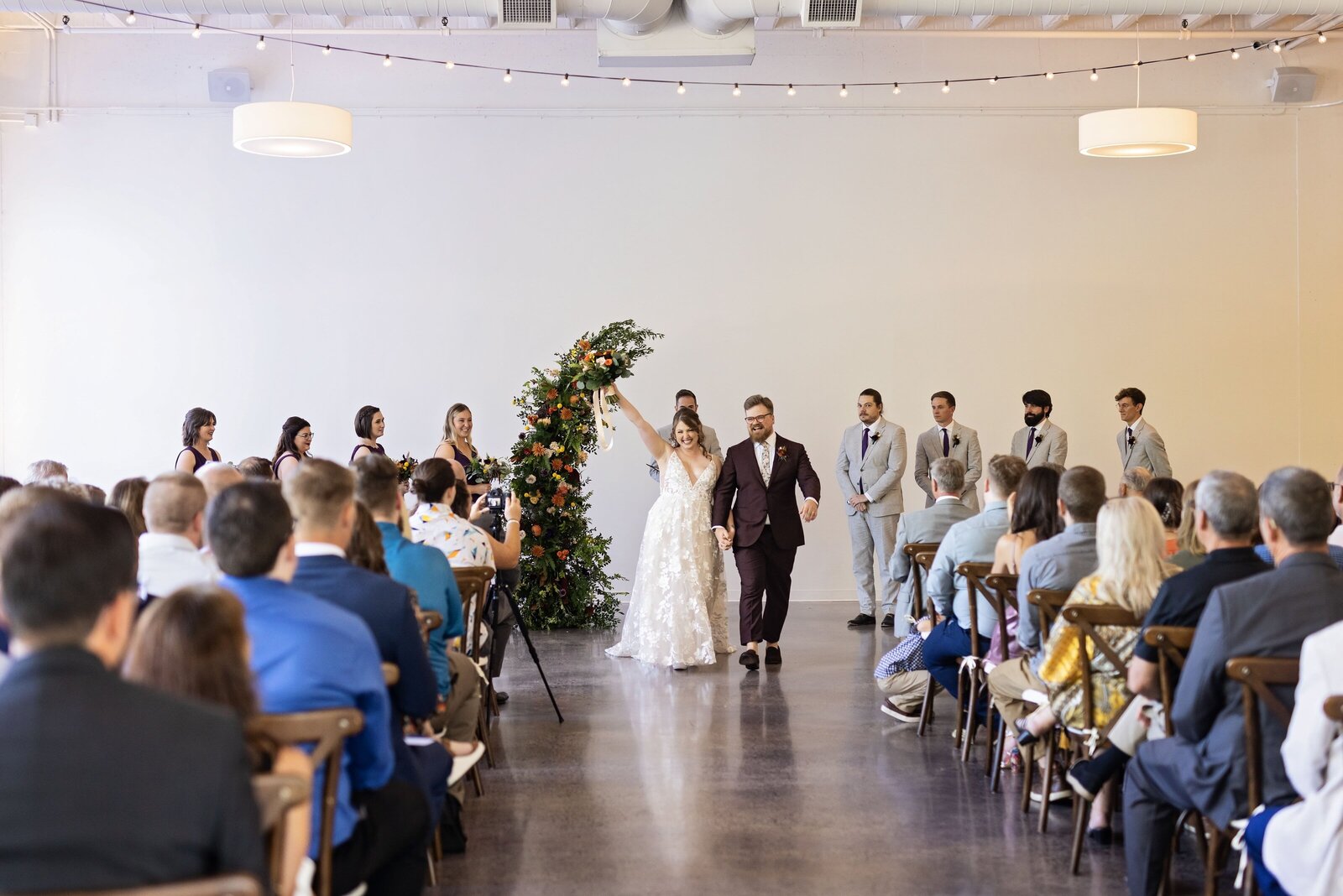 couple-celebrate-recessional-urban-daisy-ceremony