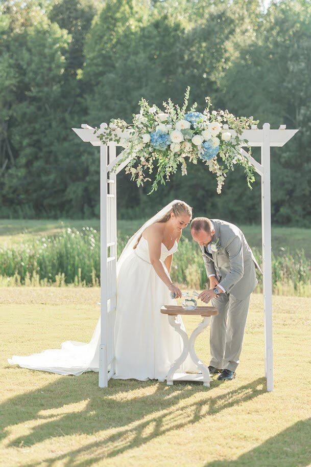 Bride-Groom-Sand-Ceremony-Arbor-Bue-White-Flowers-The-Legacy-At-Willow-Pond