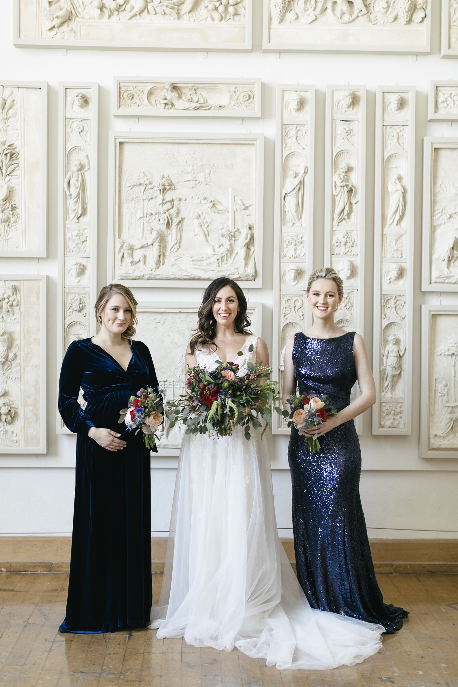 bridesmaids with blue dresses in historic cast room pafa
