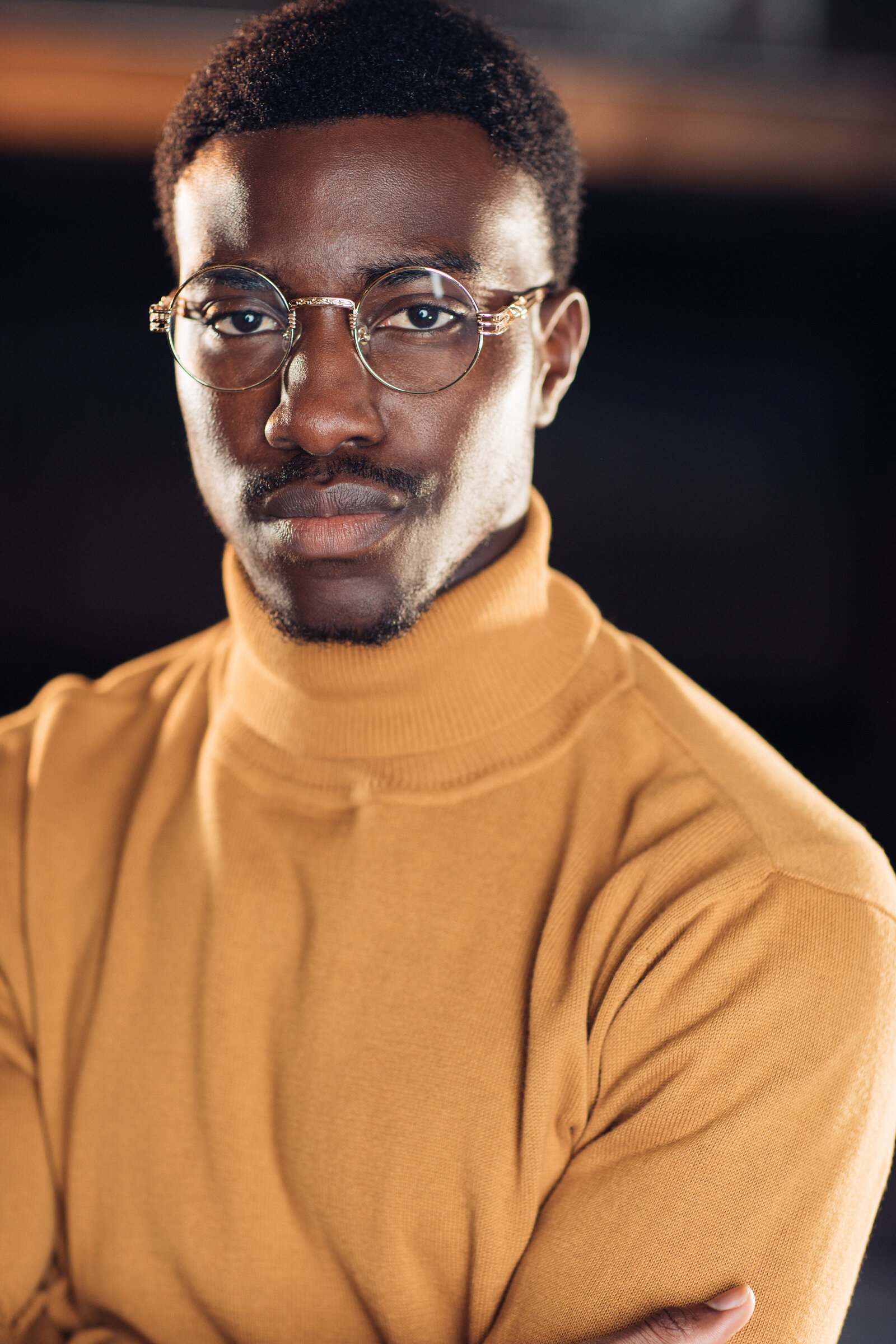 Headshot Photograph Of Young Black Man In Yellow Turtle Neck Sweater Los Angeles