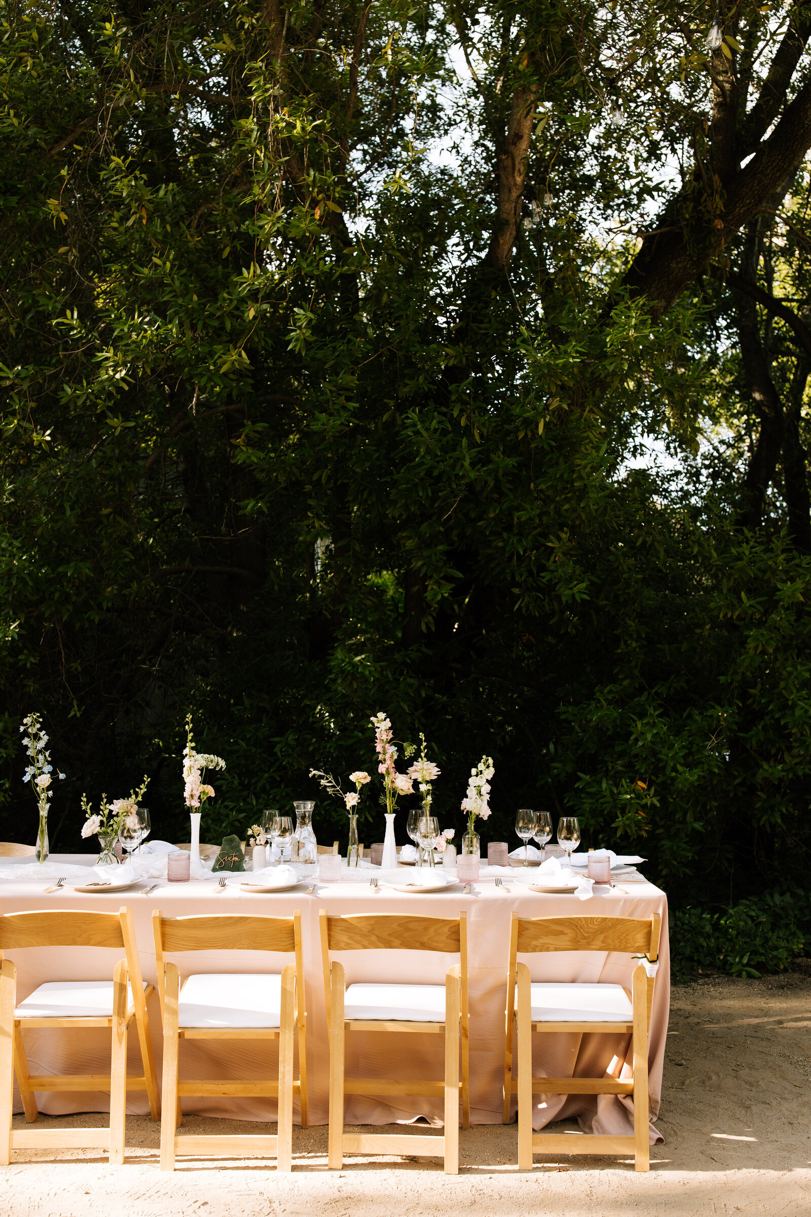 Elegant tablescape with florals and candles for McCall wedding reception