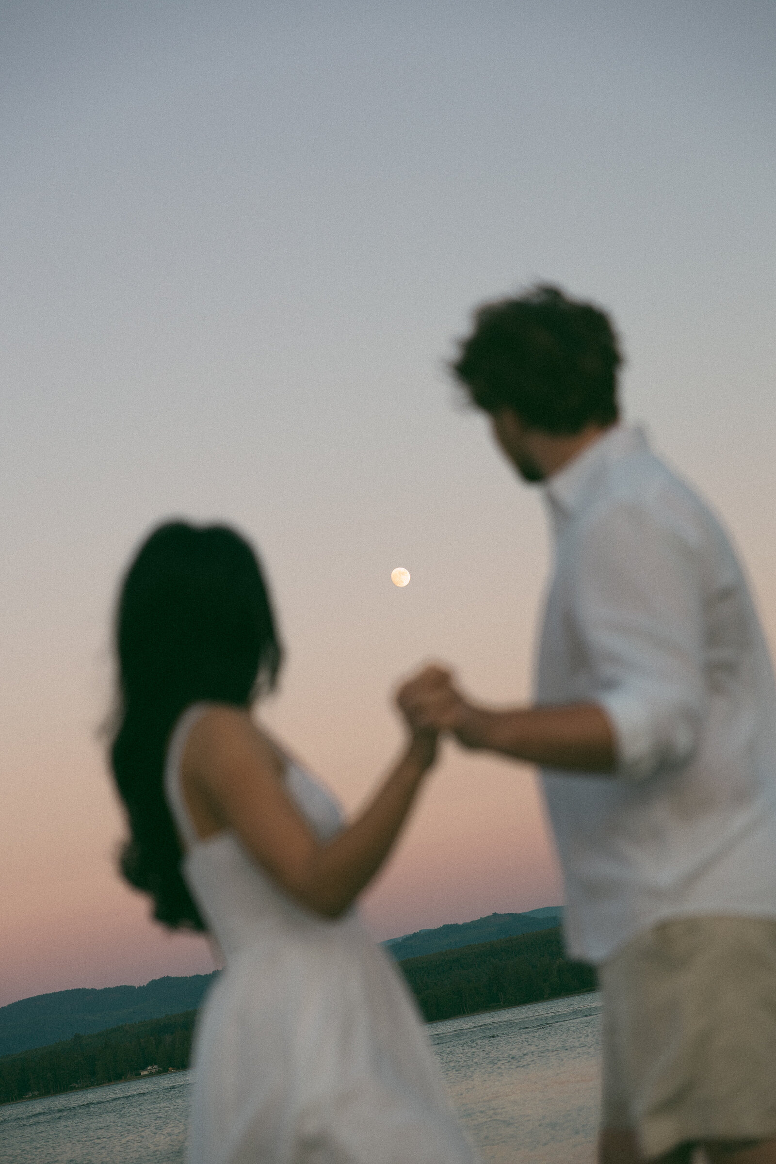 Intimate moment between a couple during their portrait session on Vancouver Island, photographed by Rae Terrillon.